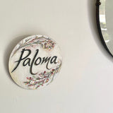 Wooden Circle 'Paloma' handpainted featuring italic writing + flower detail- COMMISSSIOND/SOLD