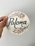 Wooden Circle 'Paloma' handpainted featuring italic writing + flower detail- COMMISSSIOND/SOLD