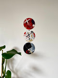 Wooden Circles 'X's and O's to the moon + back'- set of 3 x handpainted in red, white + black 15cm- SOLD